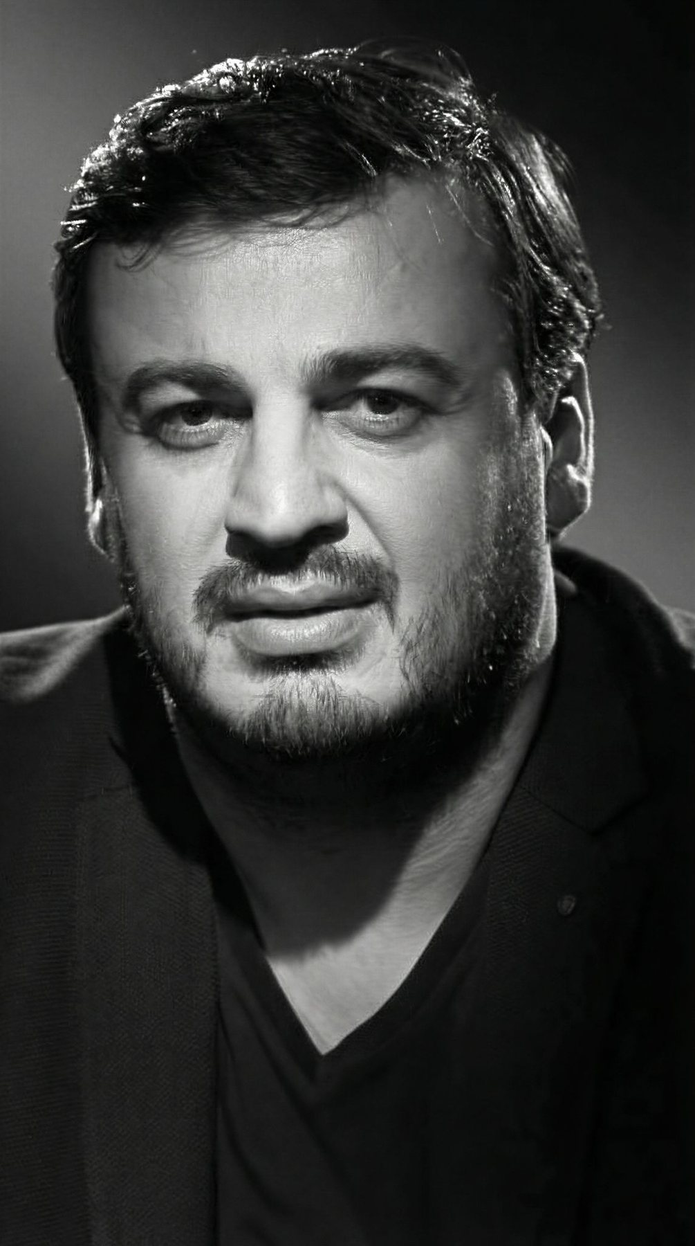 Irakli Kakhidze dramatic close portrait in studio lighting